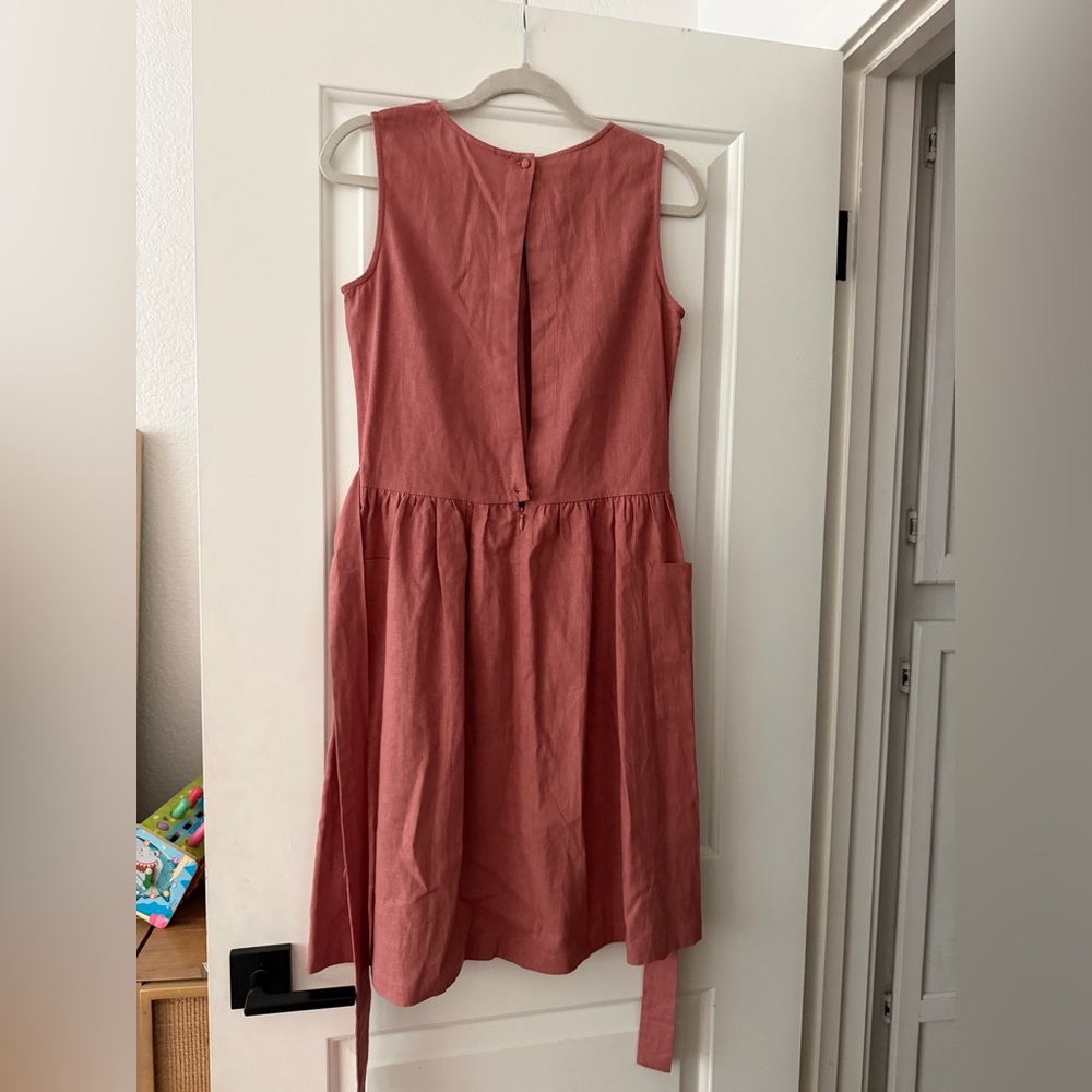 Pleione sleeveless pocketed dress in a mauve color with gathered wide tie waist